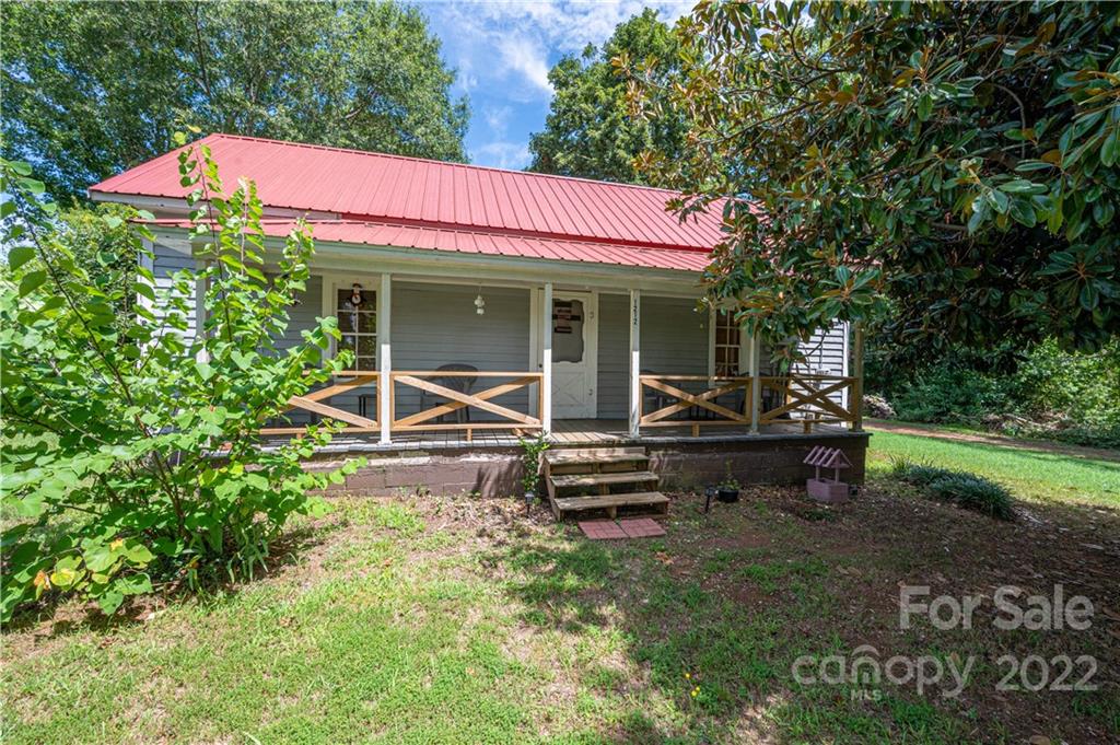 1212 Tot Dellinger Road Cherryville, NC 28021 - Photo 2 of 46 a view of a house with a yard porch and sitting area
