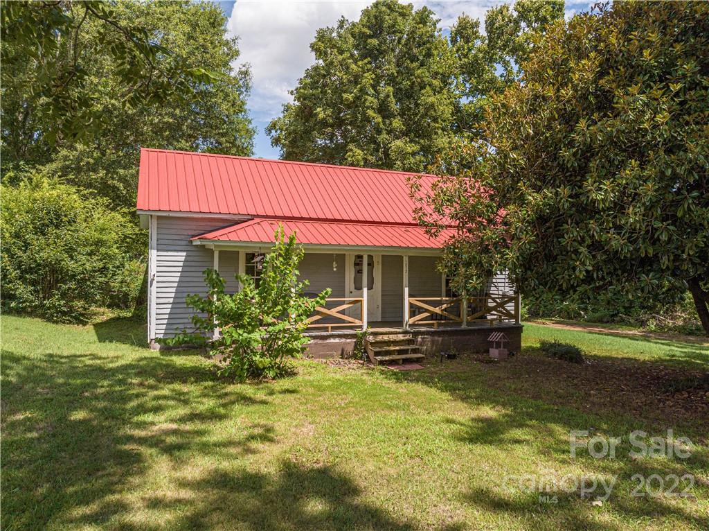 1212 Tot Dellinger Road Cherryville, NC 28021 - Photo 23 of 46 a view of a house with a yard patio and fire pit