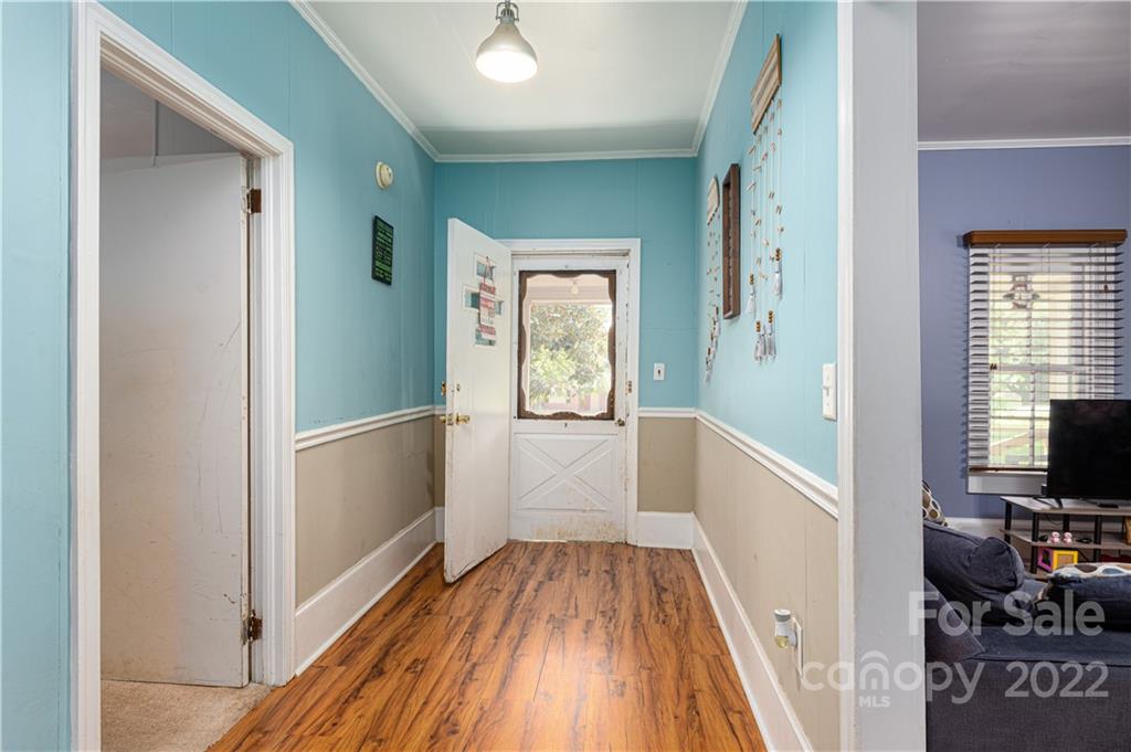 1212 Tot Dellinger Road Cherryville, NC 28021 - Photo 5 of 46 a view of a hallway view with wooden floor and furniture