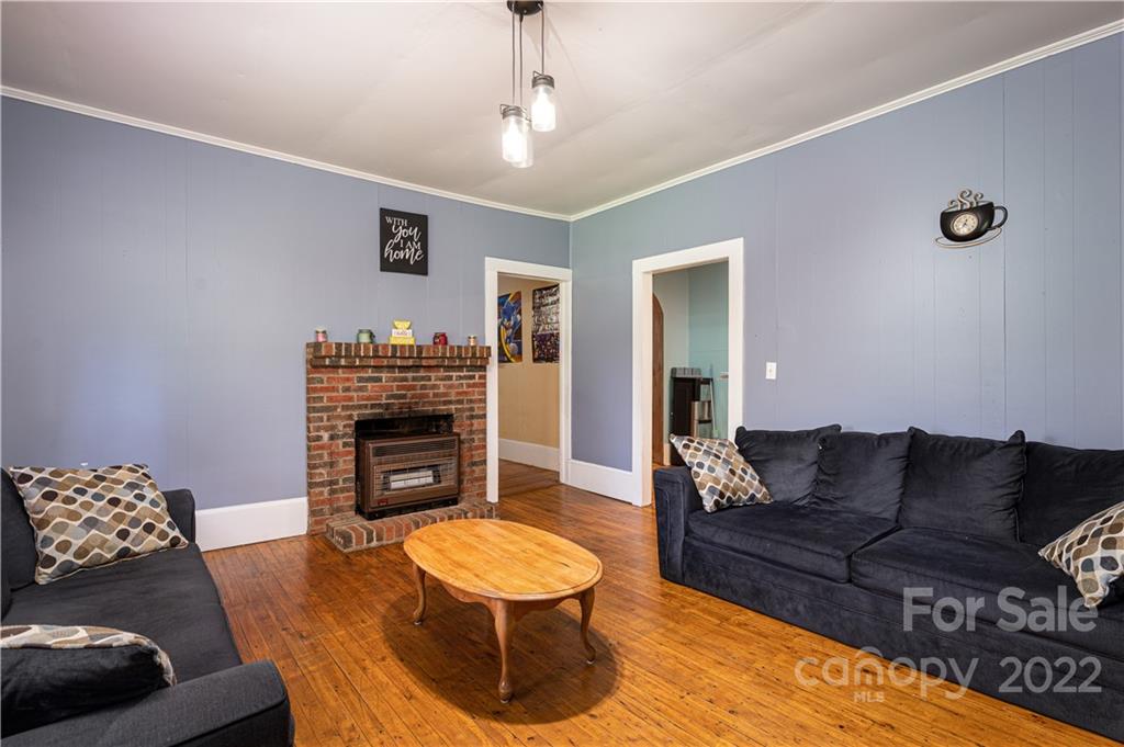 1212 Tot Dellinger Road Cherryville, NC 28021 - Photo 6 of 46 a living room with furniture and a fireplace