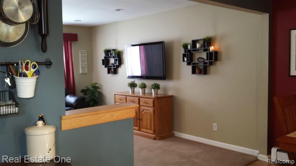 7690 South Eston Road Clarkston, MI 48348 - Photo 10 of 26 Kitchen - dining area opens up in to living room with large window and recessed lighting.