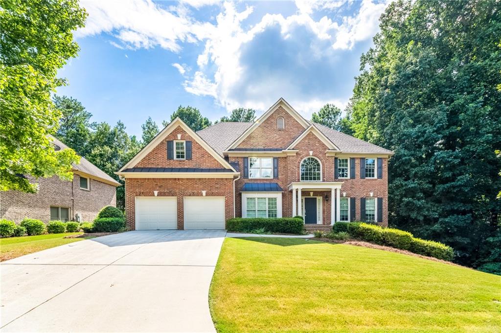 3098 Willowstone Drive Duluth, GA 30096 - Photo 1 of 1 a front view of a house with yard and parking