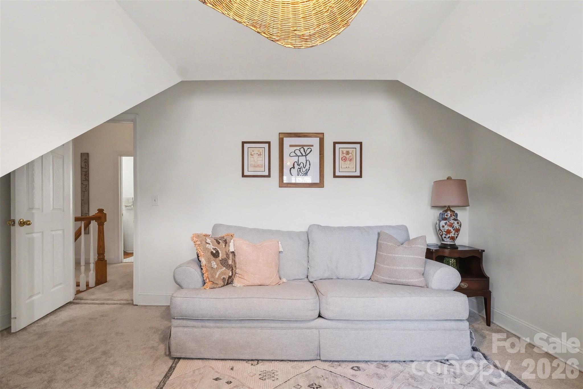 136 Spencer Street Davidson, NC 28036 - Photo 16 of 42 a living room with furniture and a couch