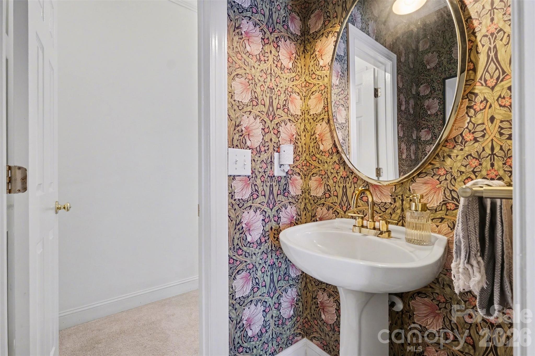 136 Spencer Street Davidson, NC 28036 - Photo 17 of 42 a bathroom with a sink and a mirror