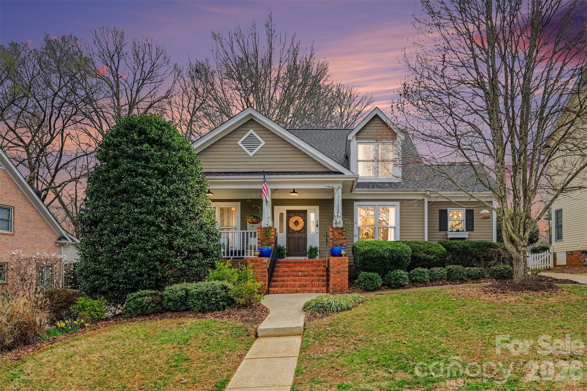 136 Spencer Street Davidson, NC 28036 - Photo 2 of 42 a front view of a house with garden
