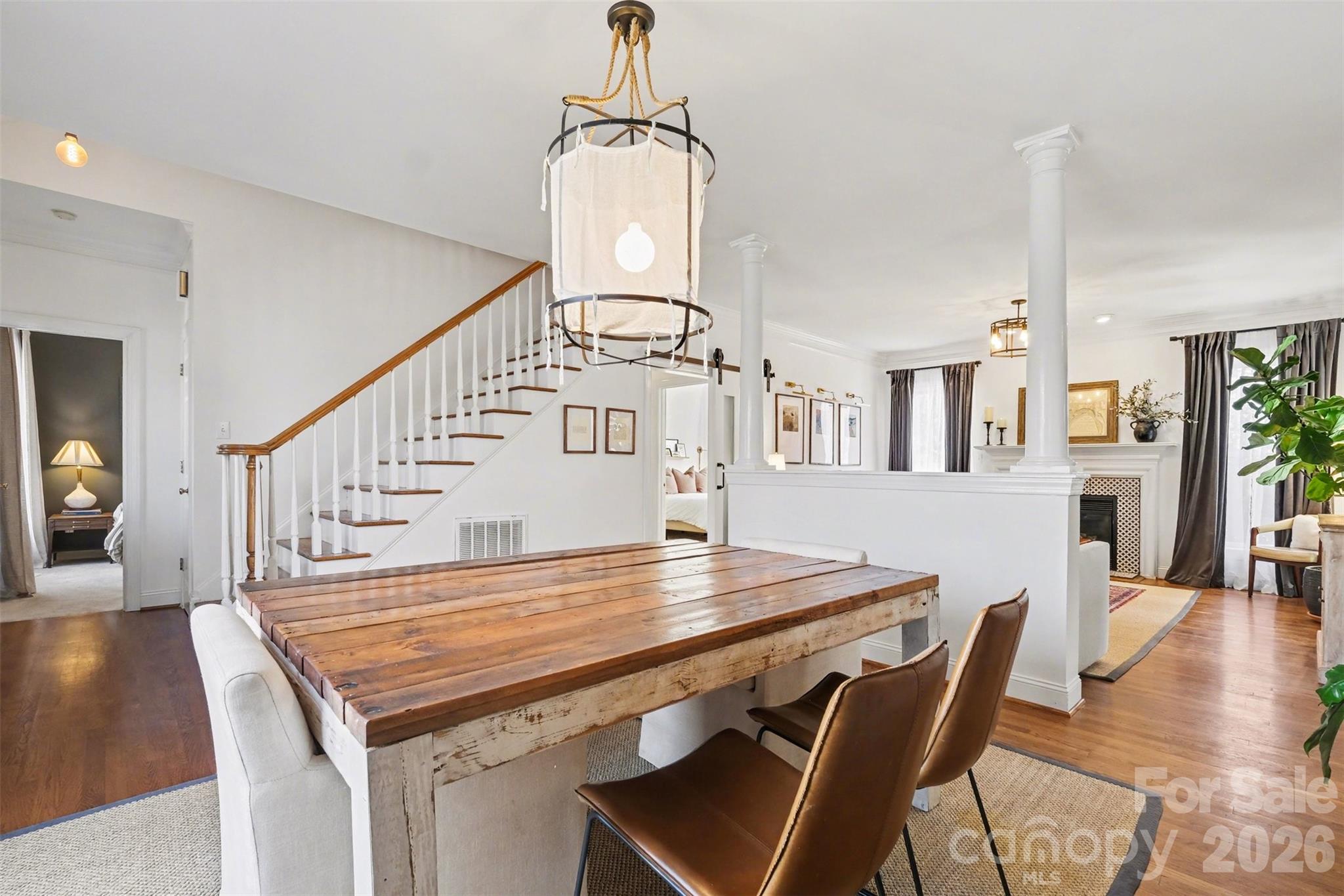 136 Spencer Street Davidson, NC 28036 - Photo 21 of 42 a view of a dining room with furniture and wooden floor