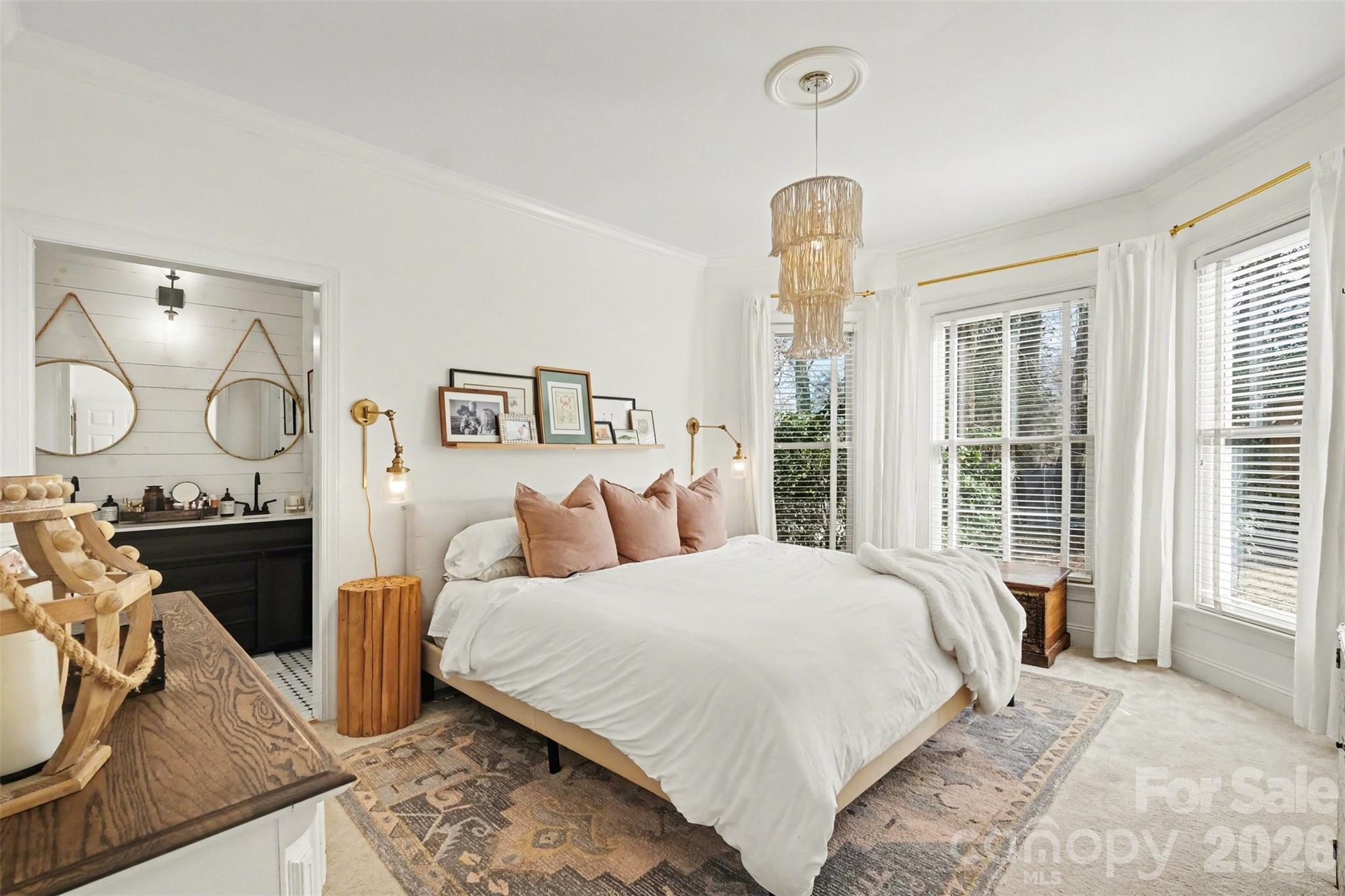 136 Spencer Street Davidson, NC 28036 - Photo 23 of 42 a bedroom with a bed mirror and window