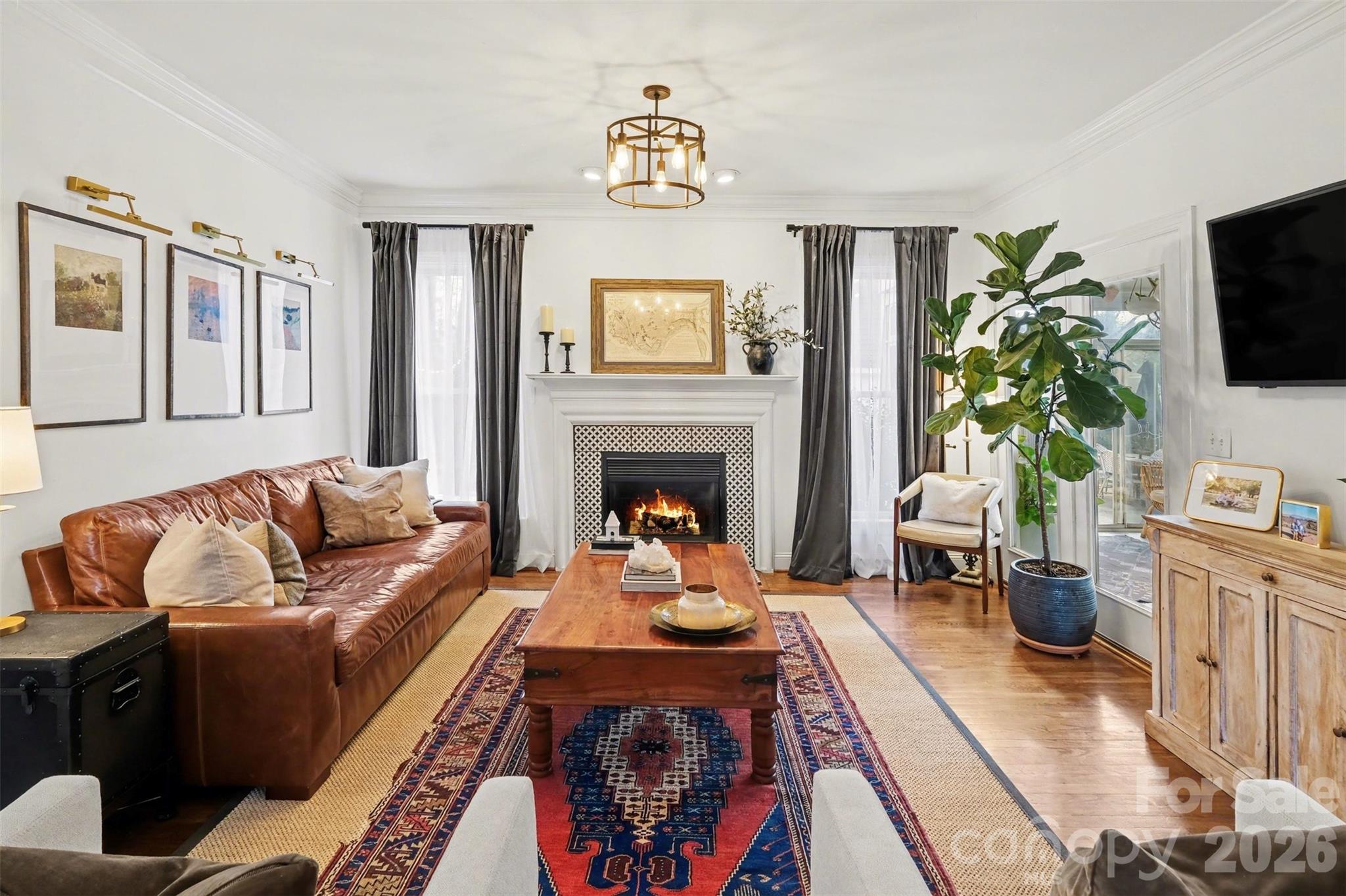 136 Spencer Street Davidson, NC 28036 - Photo 27 of 42 a living room with furniture fireplace and flat screen tv