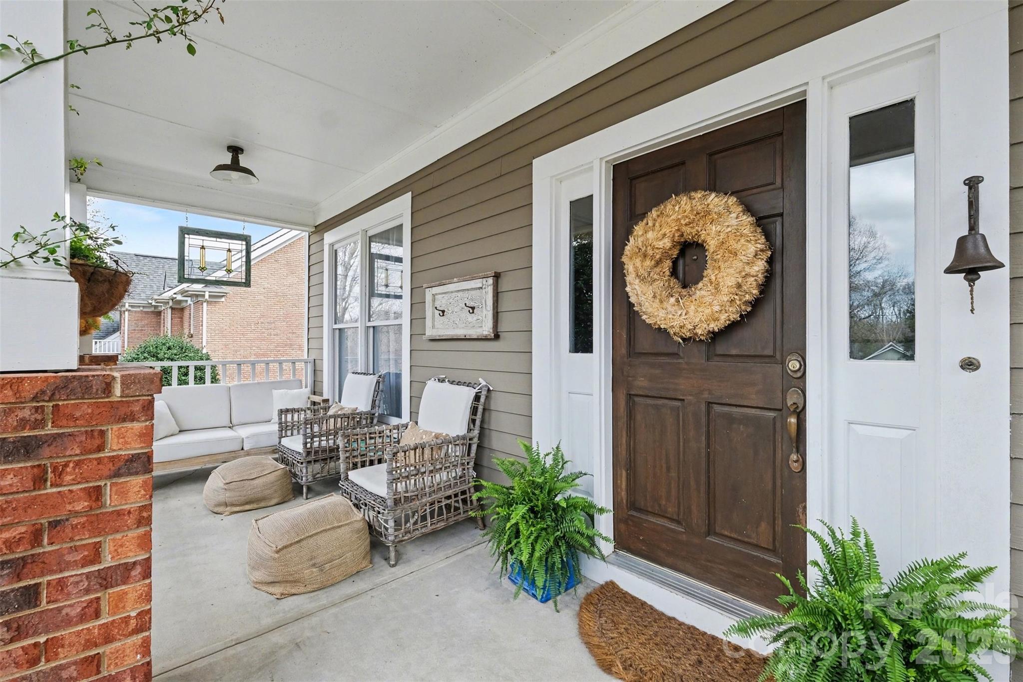 136 Spencer Street Davidson, NC 28036 - Photo 5 of 42 a living room with furniture and flowers