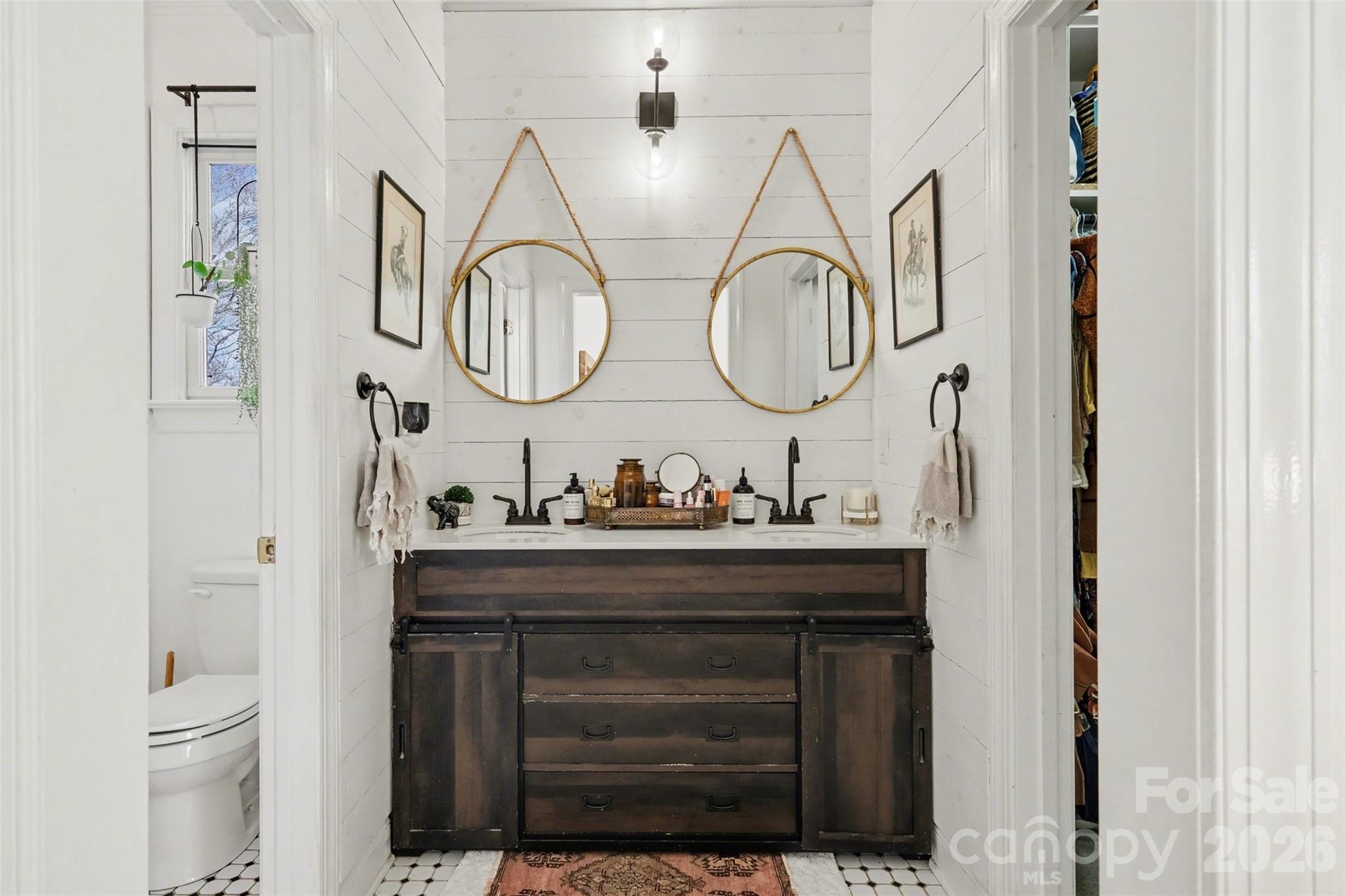 136 Spencer Street Davidson, NC 28036 - Photo 9 of 42 a bathroom with a sink and a mirror