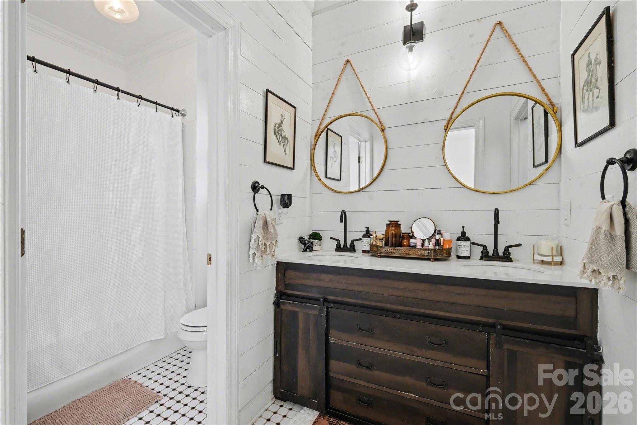 136 Spencer Street Davidson, NC 28036 - Photo 10 of 42 a bathroom with a sink and a mirror