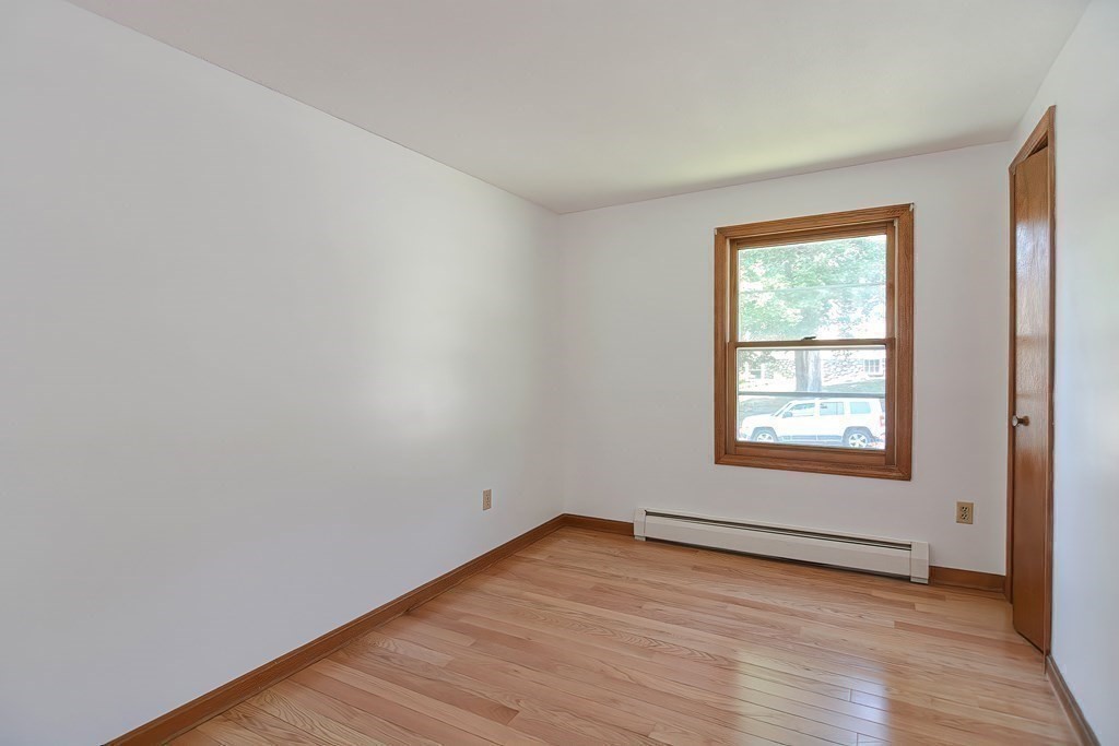 49 Hadwen Road Worcester, MA 01602 - Photo 13 of 28 an empty room with wooden floor and windows
