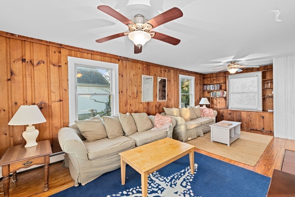 133 Phillips Road Bourne, MA 02562 - Photo 13 of 42 a living room with furniture and a large window