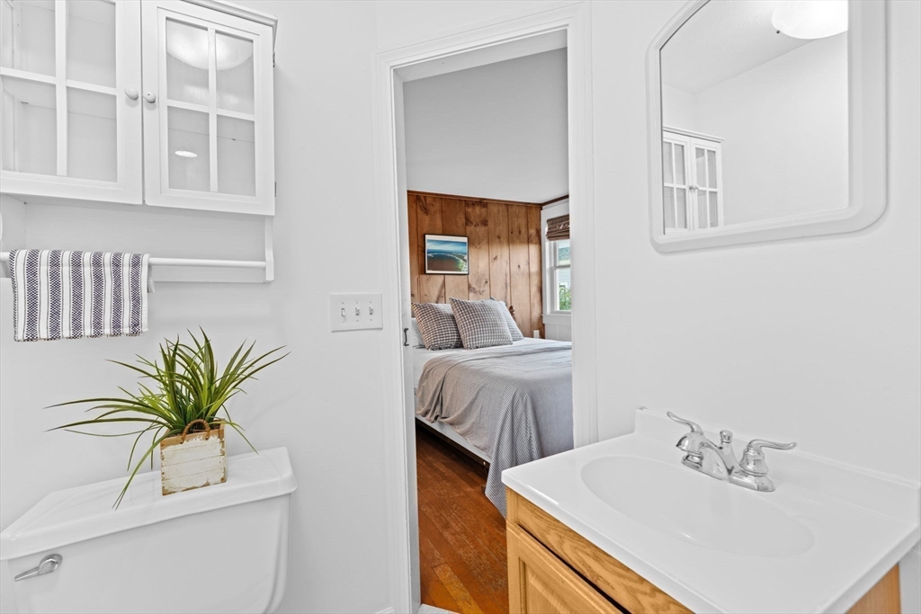 133 Phillips Road Bourne, MA 02562 - Photo 18 of 42 a bathroom with a sink a vanity and a mirror