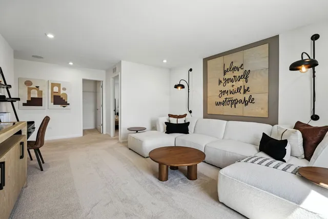 a living room with furniture and a table