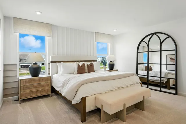 a bedroom with bed and a window