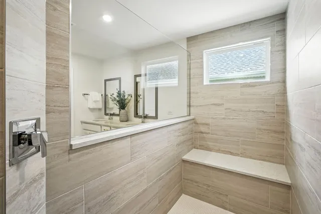 a bathroom with a bathtub and shower