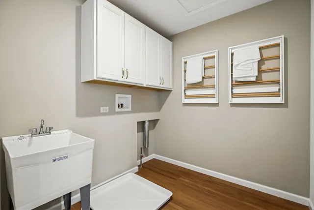 a room with a window and wooden floor