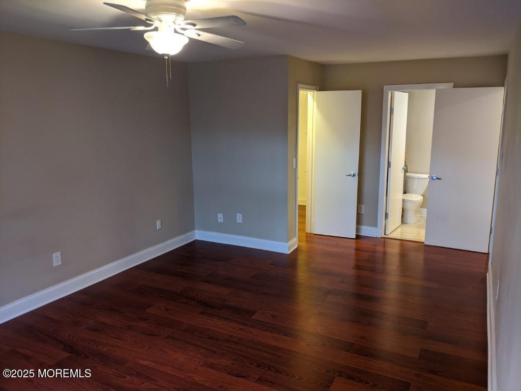 94 Azalea Circle Jackson, NJ 08527 - Photo 16 of 31 an empty room with wooden floor and chandelier fan