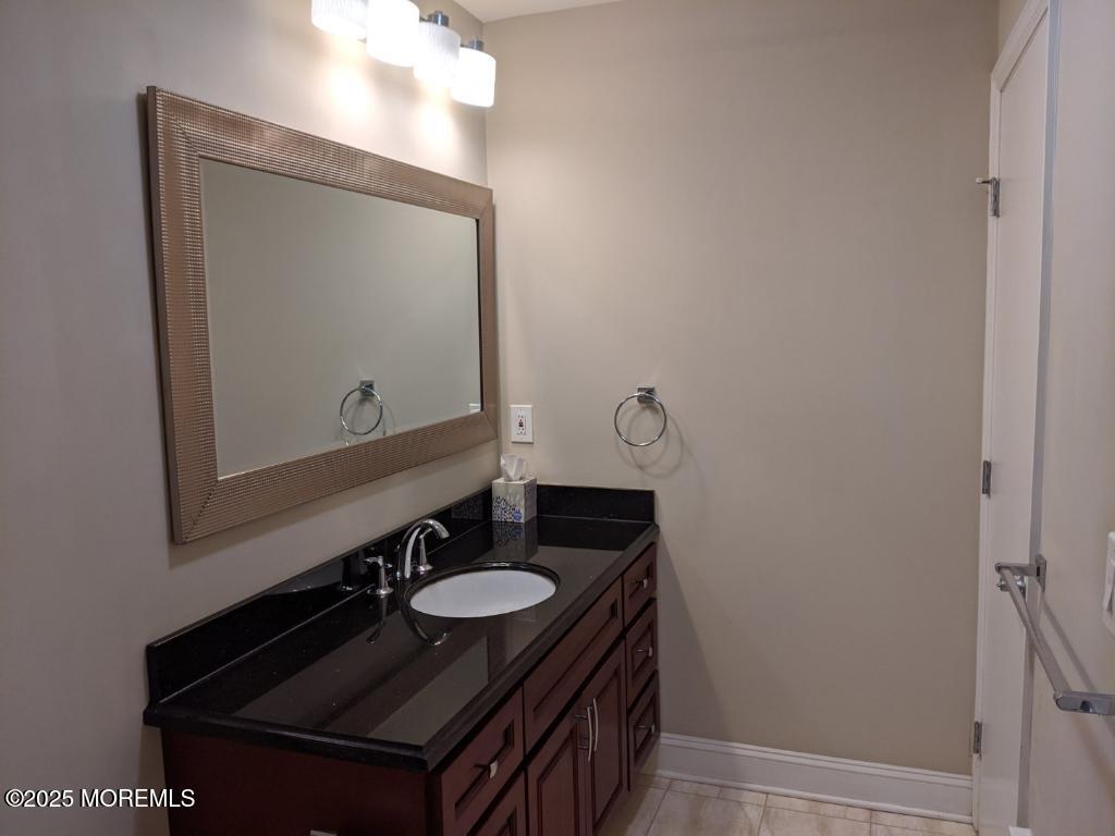 94 Azalea Circle Jackson, NJ 08527 - Photo 19 of 31 a bathroom with a sink and a mirror