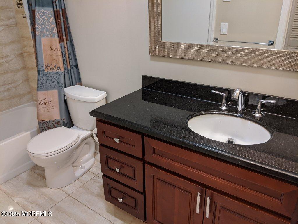 94 Azalea Circle Jackson, NJ 08527 - Photo 20 of 31 a bathroom with a granite countertop toilet sink and mirror