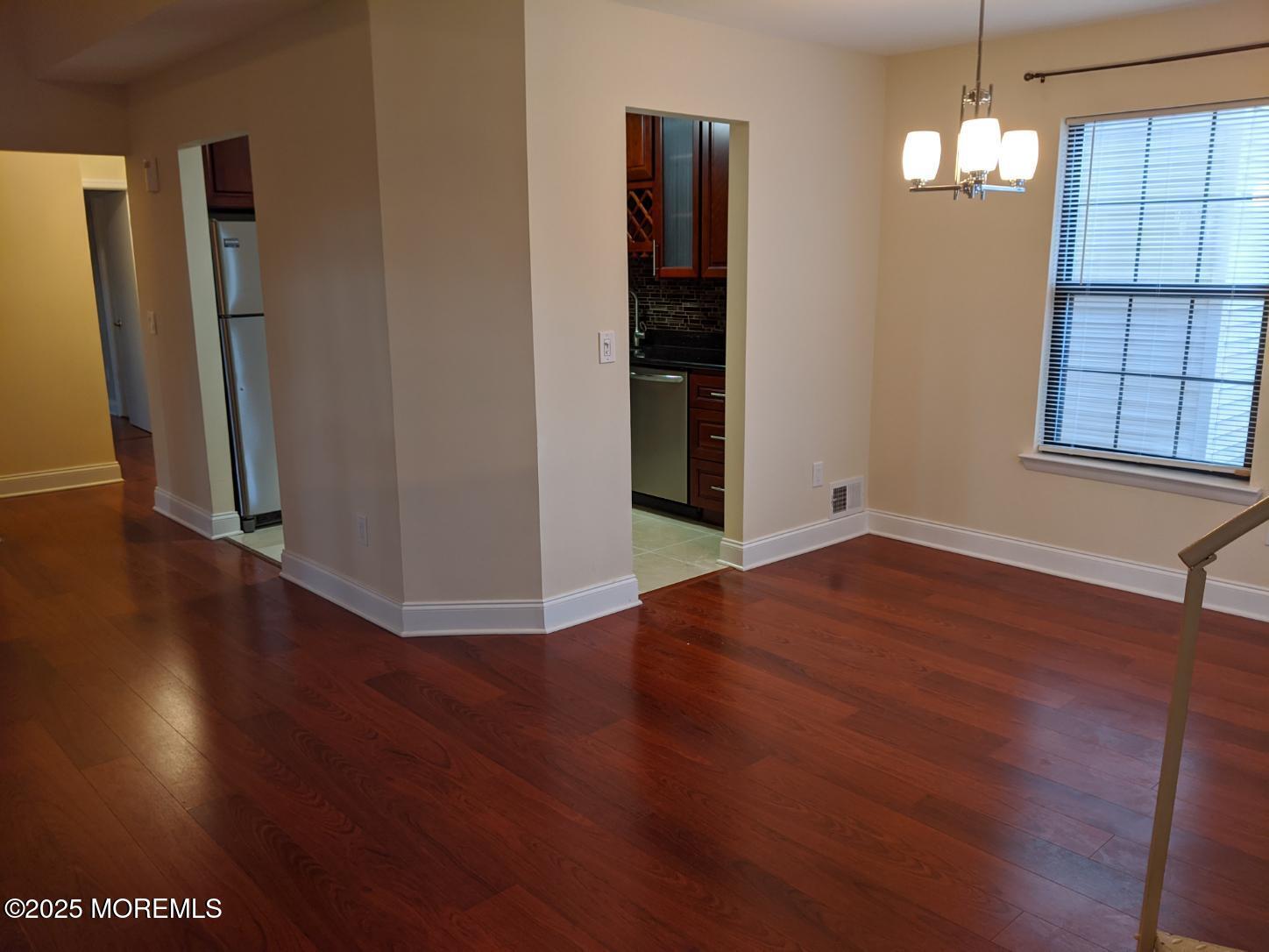 94 Azalea Circle Jackson, NJ 08527 - Photo 6 of 31 an empty room with wooden floor and windows