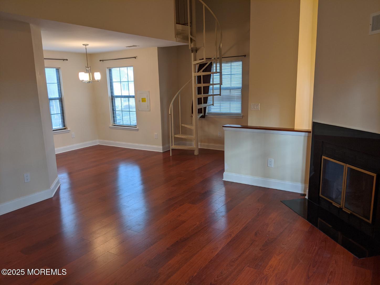 94 Azalea Circle Jackson, NJ 08527 - Photo 8 of 31 a view of an empty room with wooden floor and a window