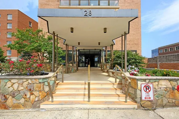 a view of a building with sitting area