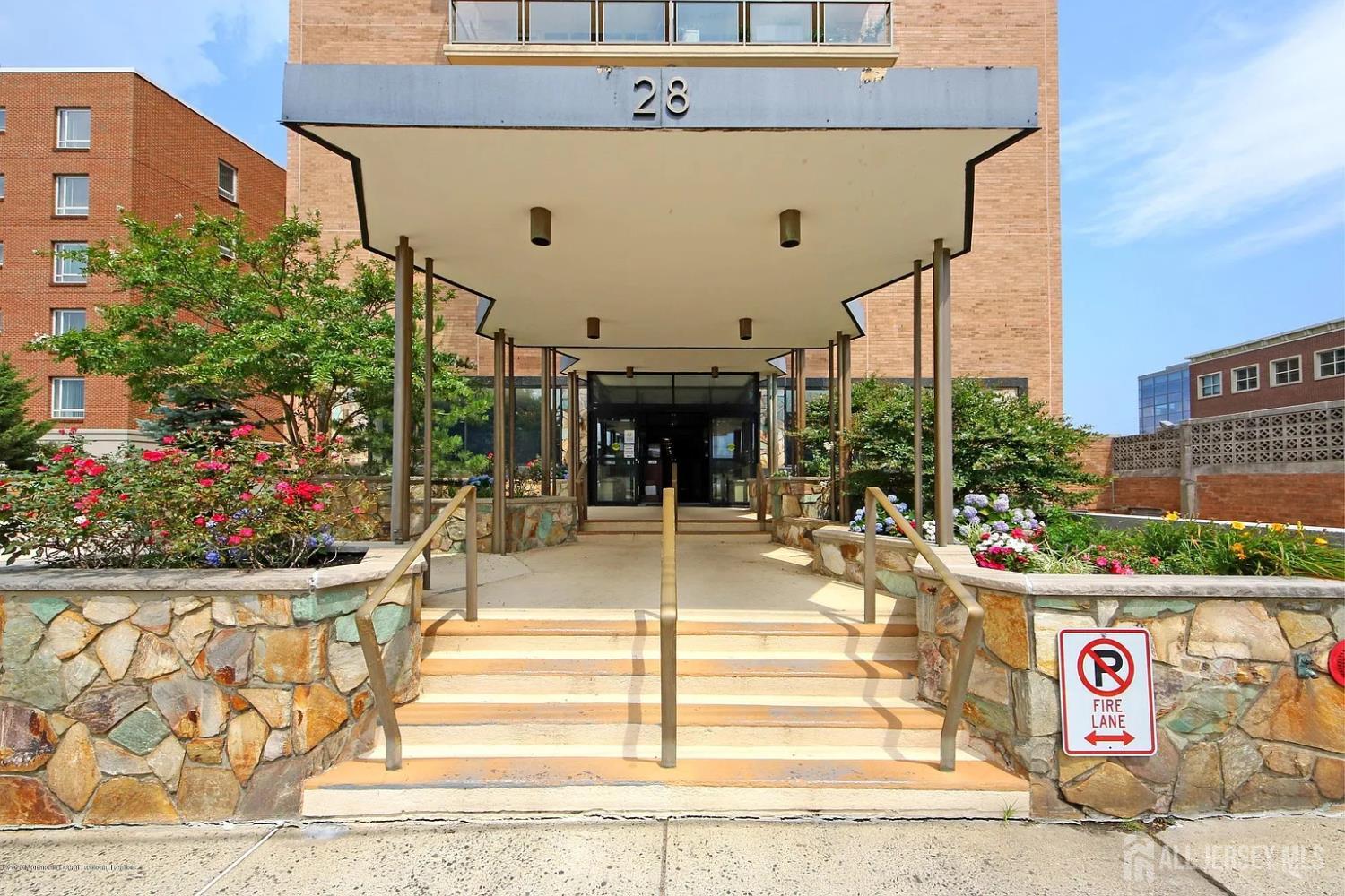 a view of a building with sitting area