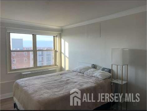 28 Riverside Avenue, Unit 11H Red Bank, NJ 07701 - Photo 5 of 5 a bedroom with a bed and window