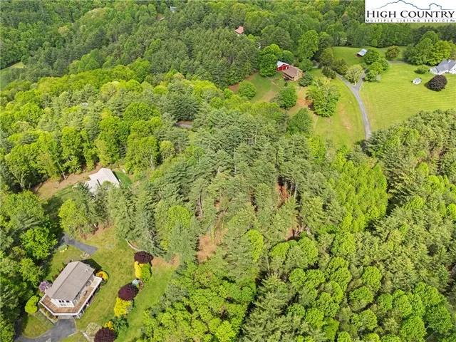 a view of a garden with a building