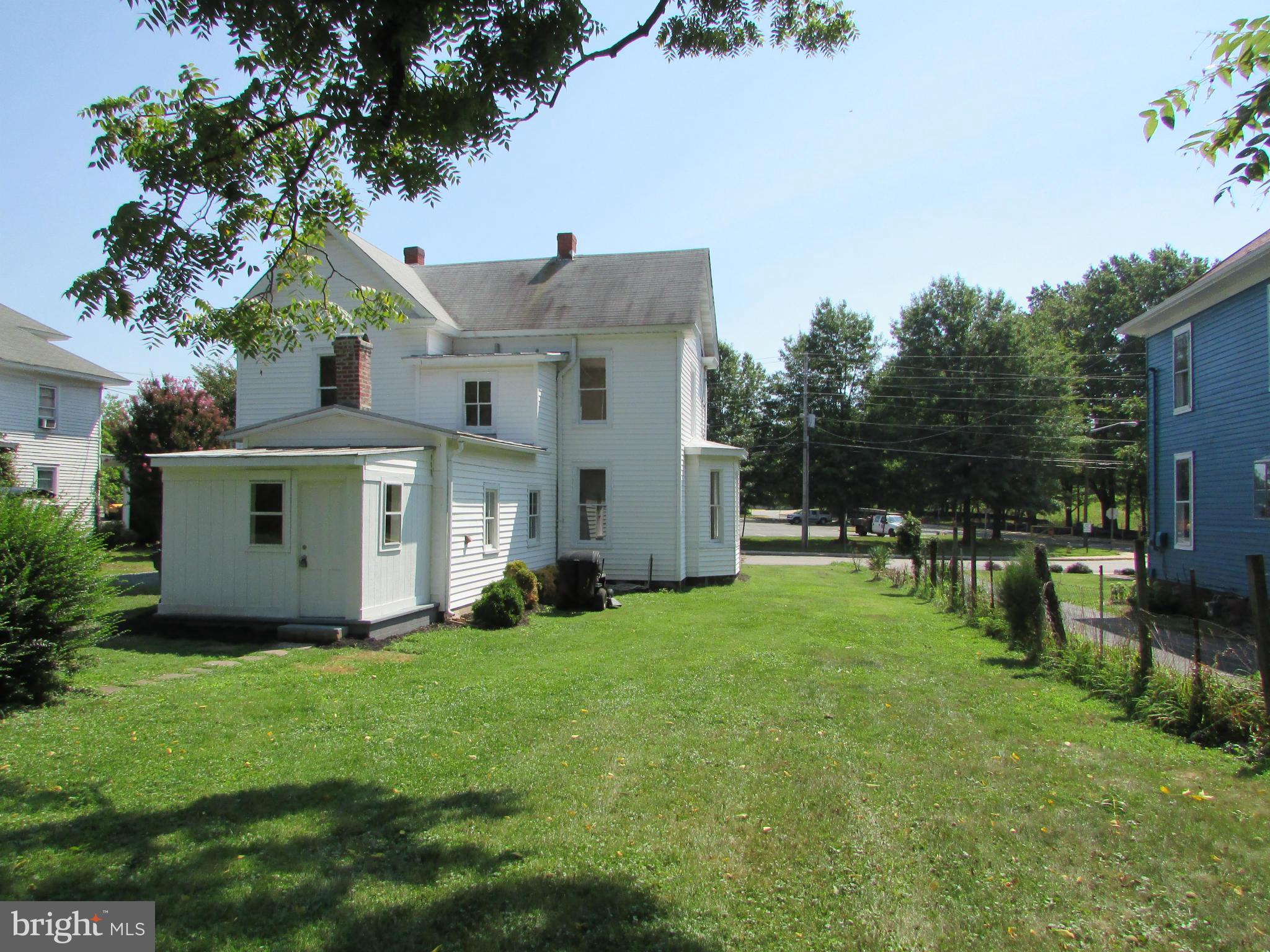 9520 Main Street Manassas, VA 20110 - Photo 2 of 19 a view of a house with backyard garden and sitting area