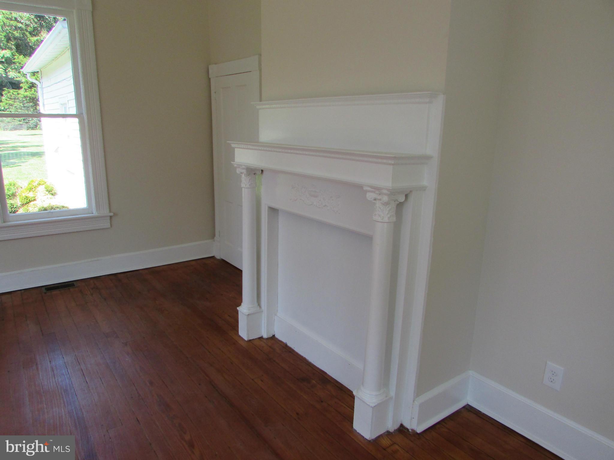 9520 Main Street Manassas, VA 20110 - Photo 11 of 19 an empty room with wooden floor and windows