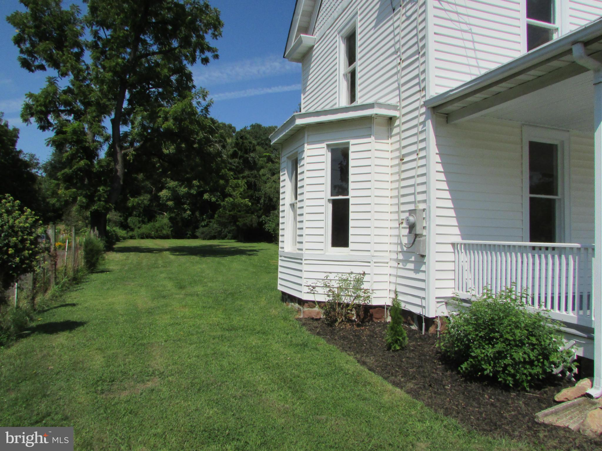 9520 Main Street Manassas, VA 20110 - Photo 17 of 19 a view of a house with a yard