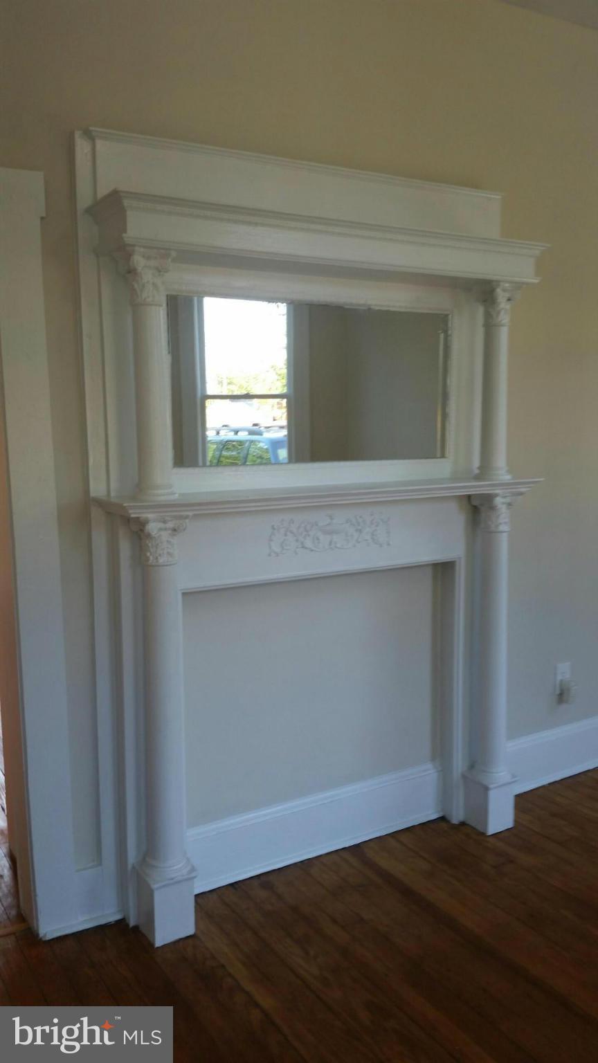9520 Main Street Manassas, VA 20110 - Photo 8 of 19 a bedroom with a bed and a window