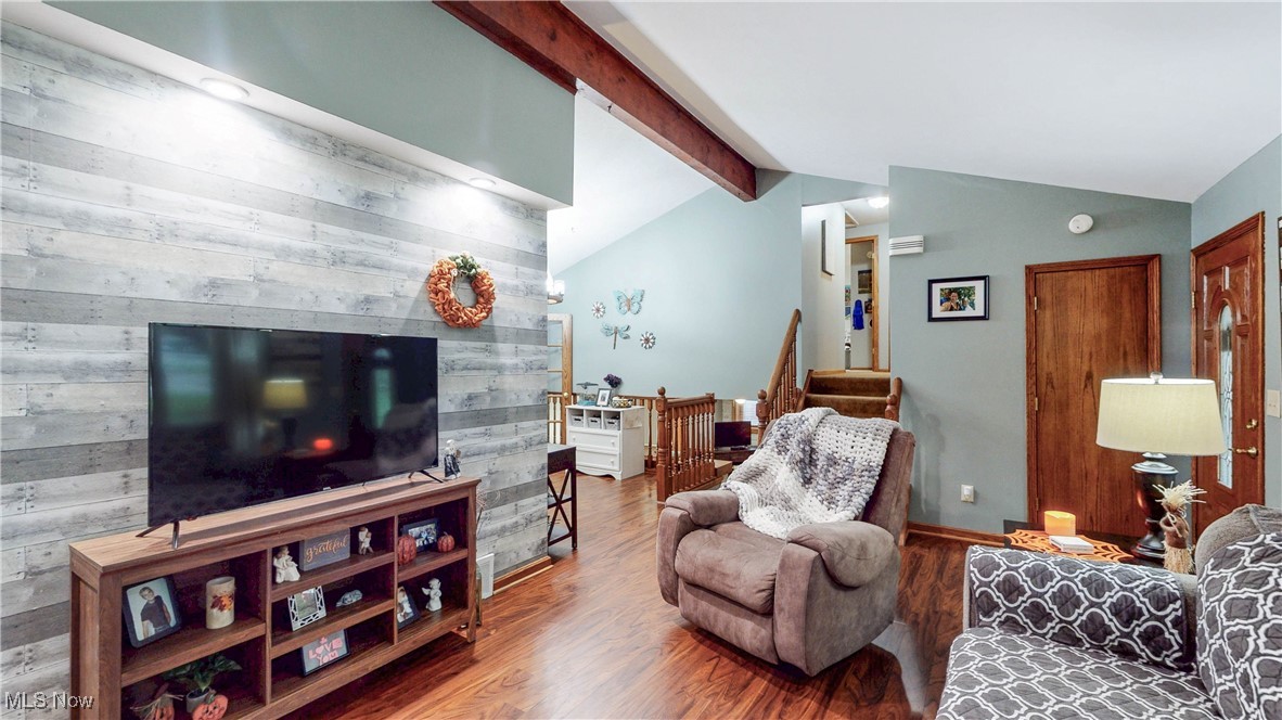 3123 Clearview Road Ravenna, OH 44266 - Photo 13 of 44 Living room featuring wood finished floors and wood walls