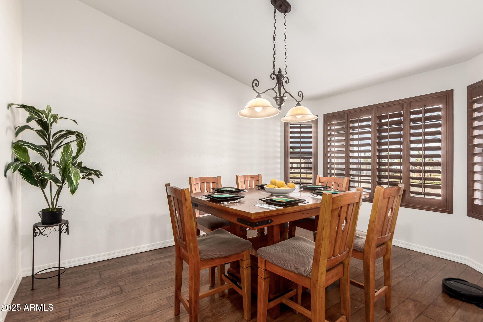 17645 East Stacey Road Queen Creek, AZ 85142 - Photo 13 of 109 a view of a dining room with furniture window and wooden floor
