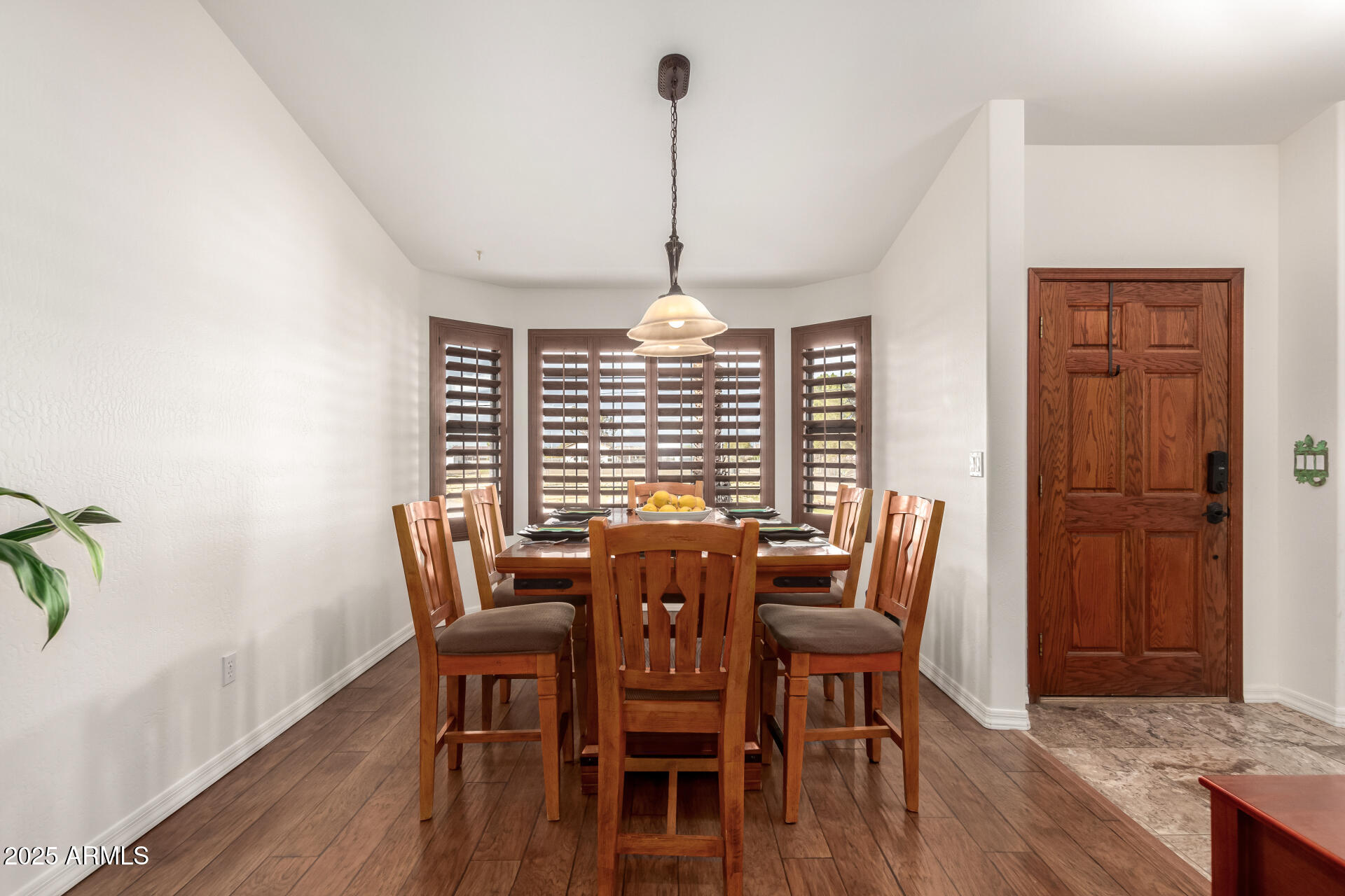 17645 East Stacey Road Queen Creek, AZ 85142 - Photo 14 of 109 a view of a dining room with furniture window and wooden floor