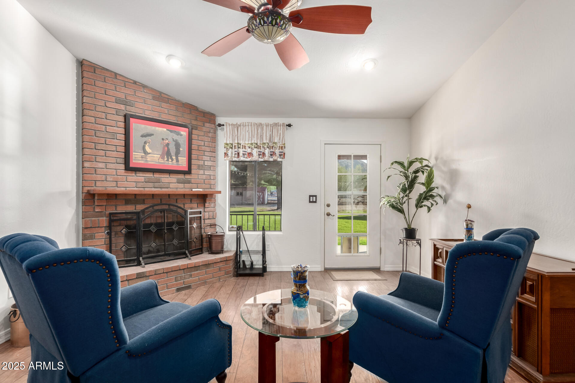 17645 East Stacey Road Queen Creek, AZ 85142 - Photo 19 of 109 a living room with furniture a window and a fireplace