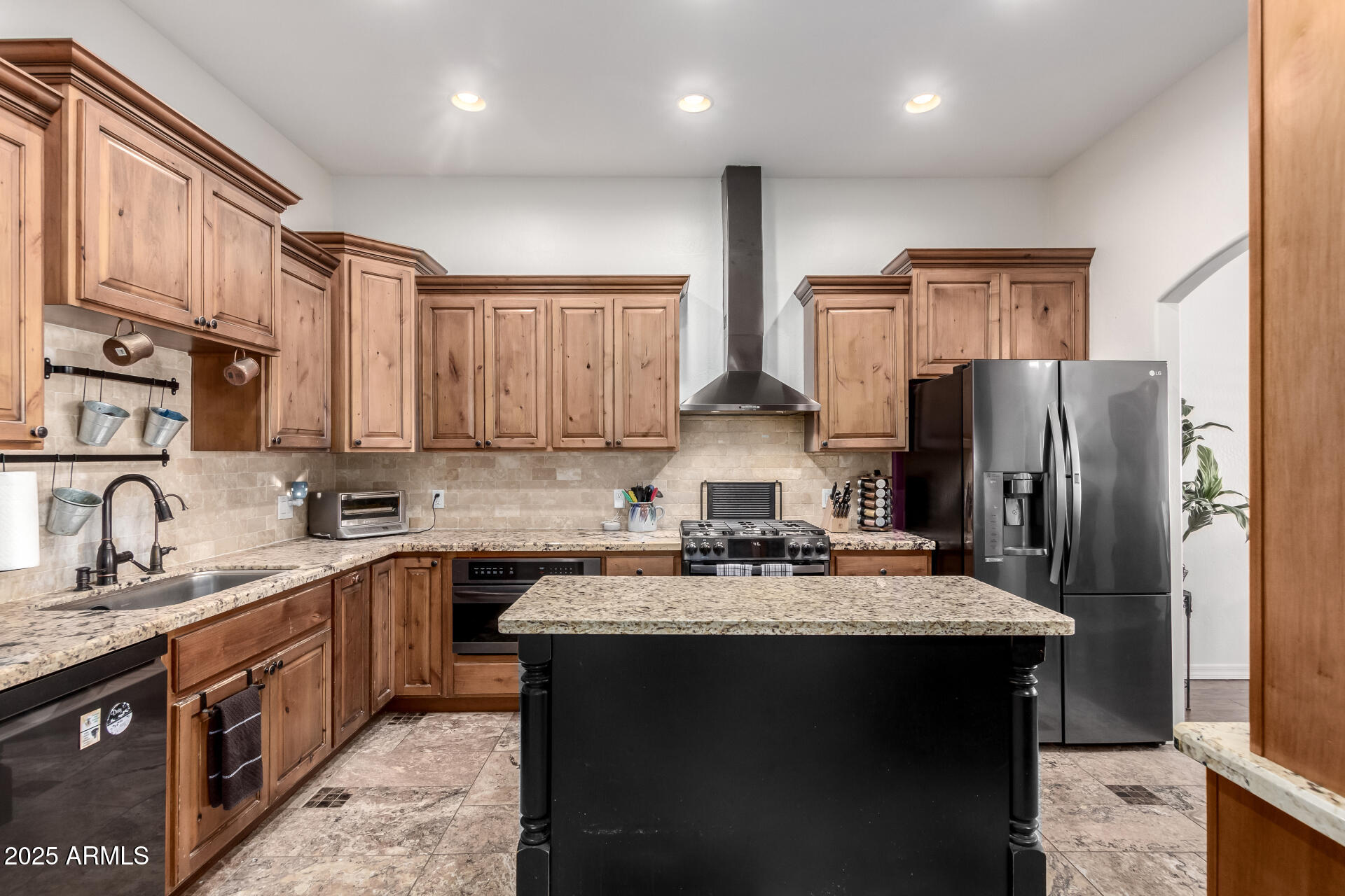 17645 East Stacey Road Queen Creek, AZ 85142 - Photo 20 of 109 a kitchen with stainless steel appliances granite countertop a sink stove refrigerator and cabinets
