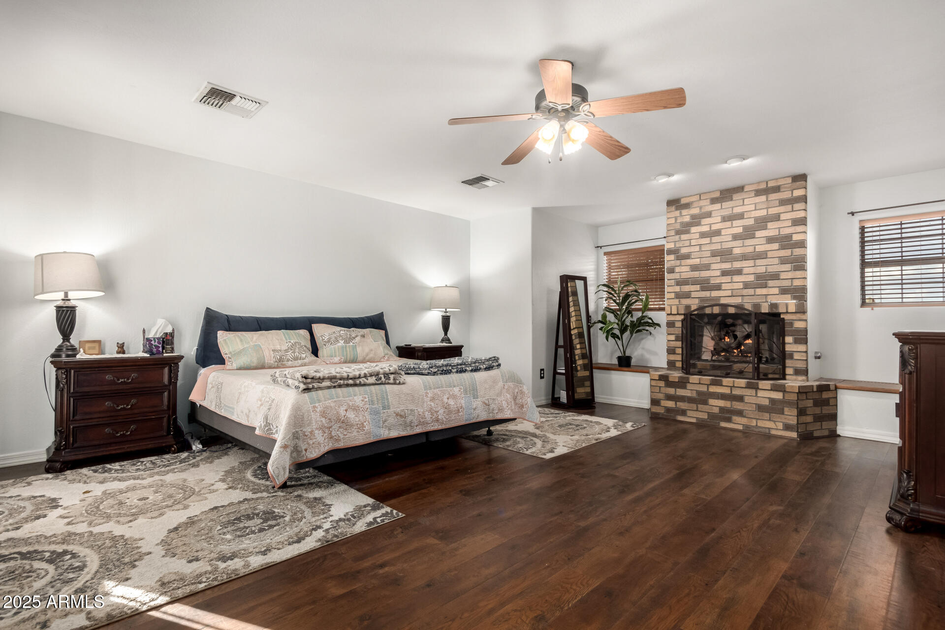 17645 East Stacey Road Queen Creek, AZ 85142 - Photo 25 of 109 a spacious bedroom with a bed and wooden floor