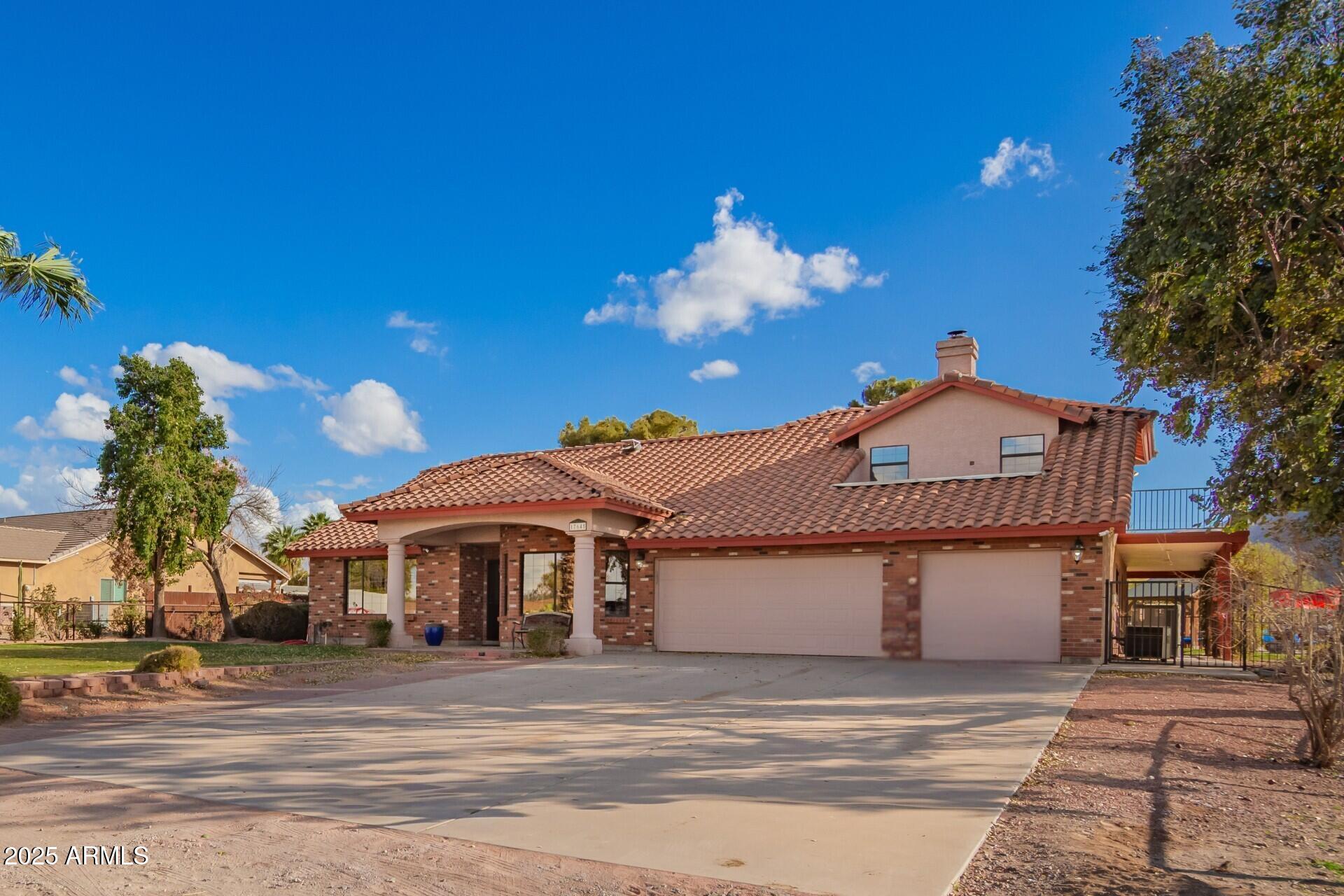 17645 East Stacey Road Queen Creek, AZ 85142 - Photo 5 of 109 a front view of a house with a yard