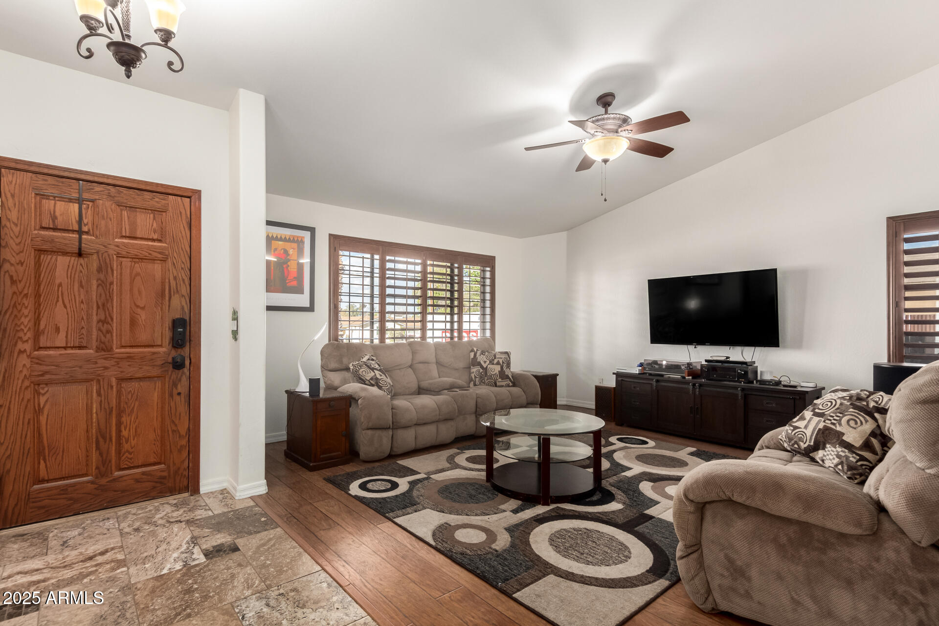 17645 East Stacey Road Queen Creek, AZ 85142 - Photo 7 of 109 a living room with furniture and a flat screen tv