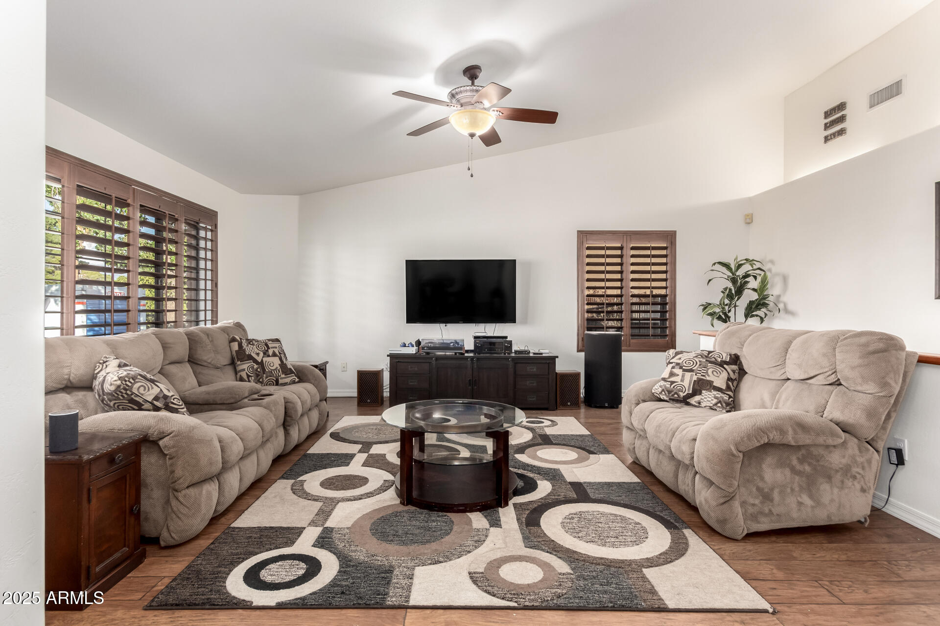 17645 East Stacey Road Queen Creek, AZ 85142 - Photo 10 of 109 a living room with furniture and a flat screen tv