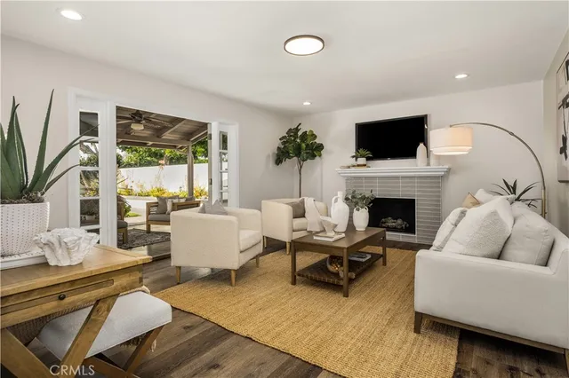 a living room with furniture fireplace and a flat screen tv