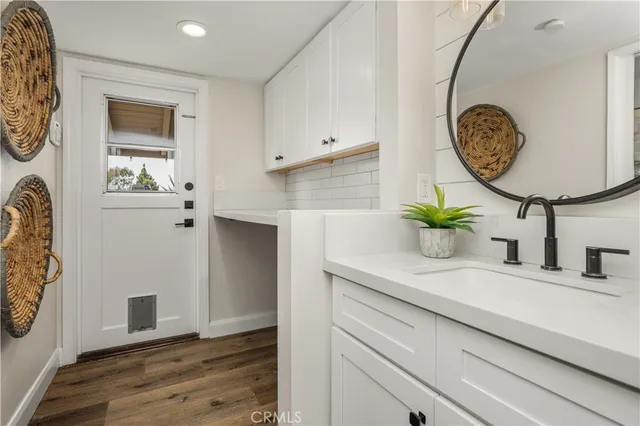 a bathroom with a sink and a mirror
