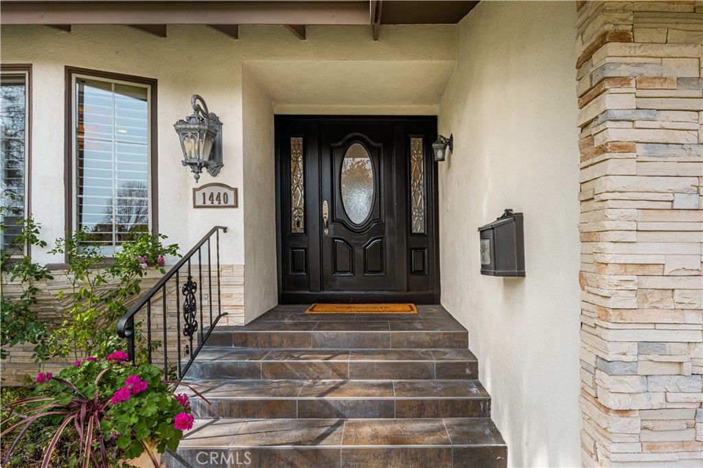 1440 North Harding Street Orange, CA 92867 - Photo 3 of 38 a front view of a house with a porch