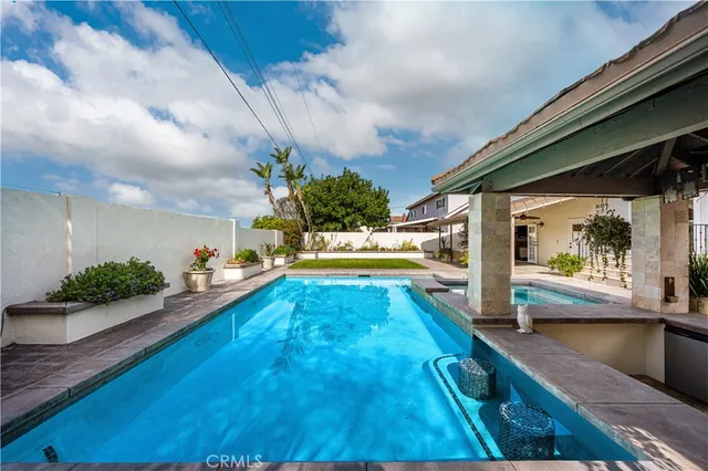 a swimming pool view with a garden space