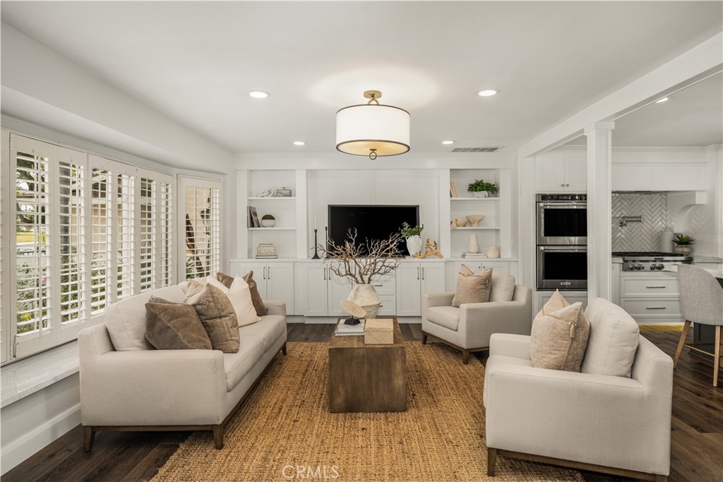 1440 North Harding Street Orange, CA 92867 - Photo 4 of 38 a living room with furniture fireplace and a flat screen tv