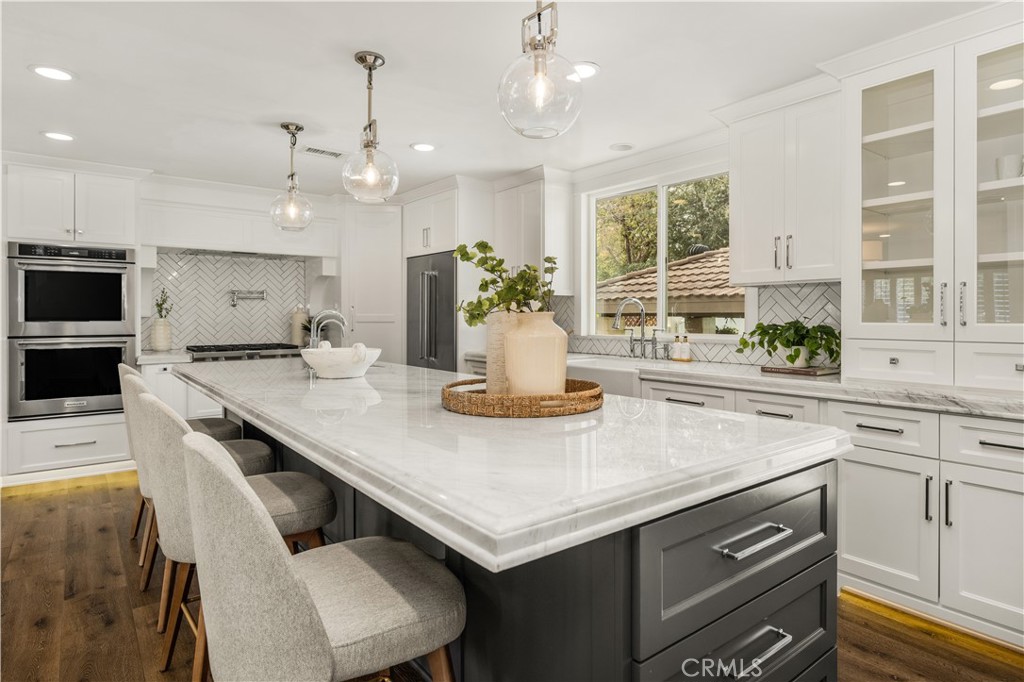 1440 North Harding Street Orange, CA 92867 - Photo 10 of 38 a kitchen with a stove a sink and a refrigerator